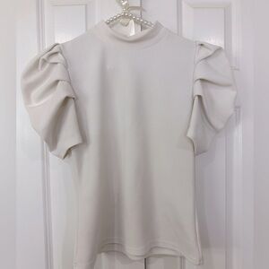 White work top with puff short sleeve accent. Size large.